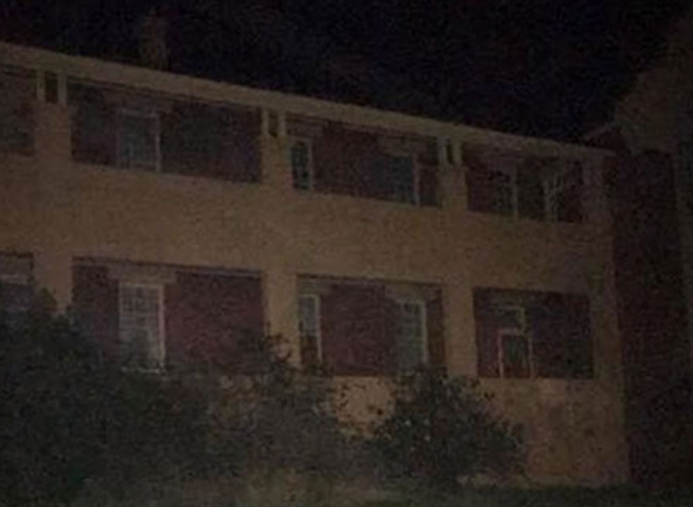 Ghostly figure sighting on the roof of an old asylum